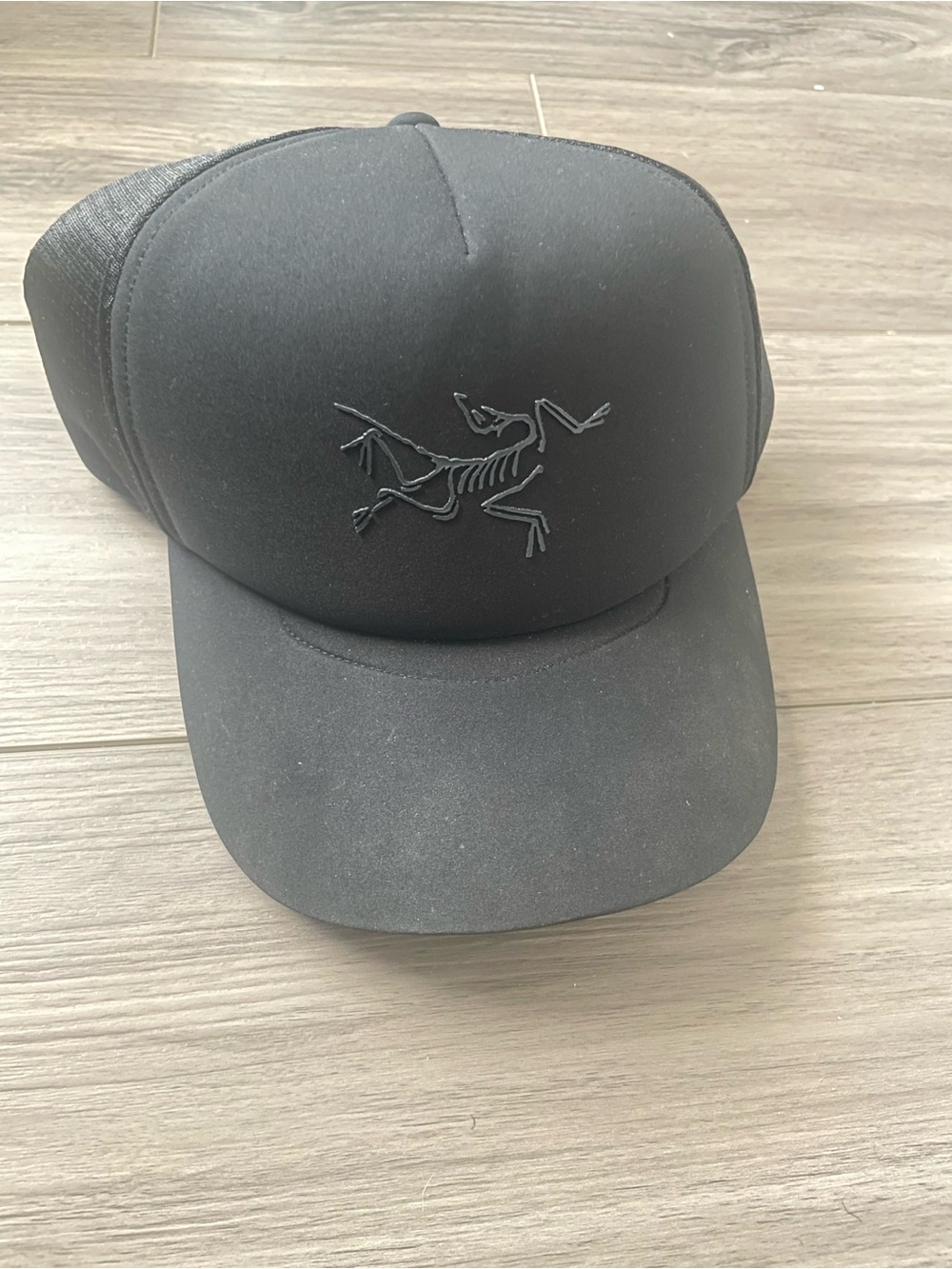 Arcteryx Men's Black Trucker Cap with Embroidered Skeleton Logo